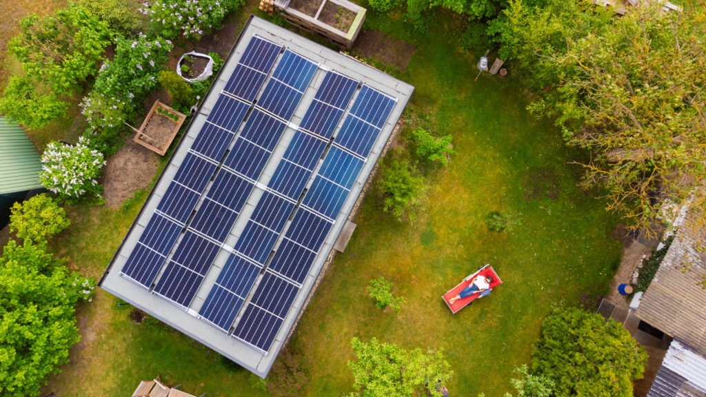 Person lounging by solar panels