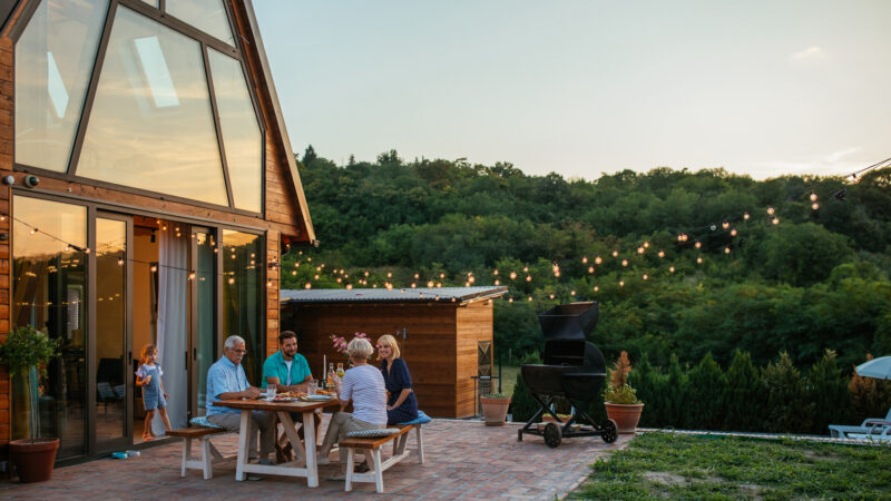 Family having a dinner at a farm estate.
